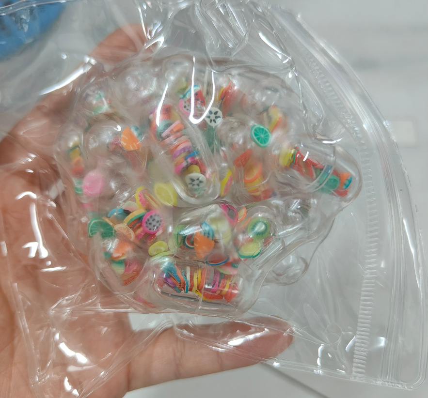 20559-Bola sonajero cápsula de frutas