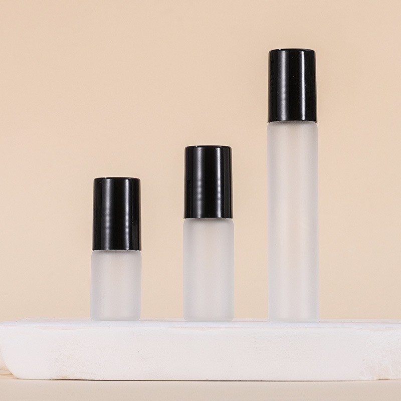 Frosted bottle + Steel roller ball + Plastic black cap