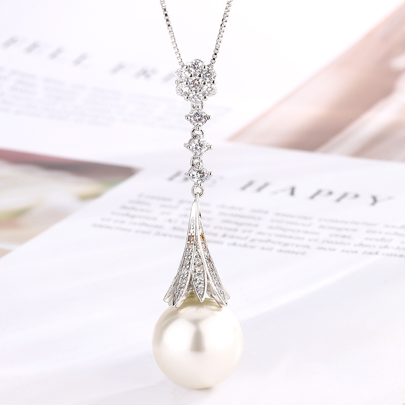 Pendentif perle blanche