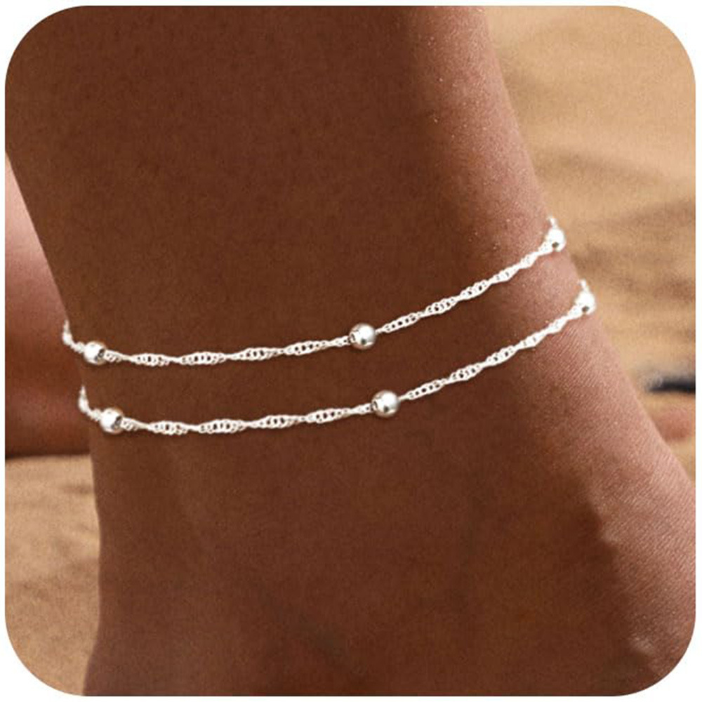 Perles à clip argentées à double couche avec motif ondulé.