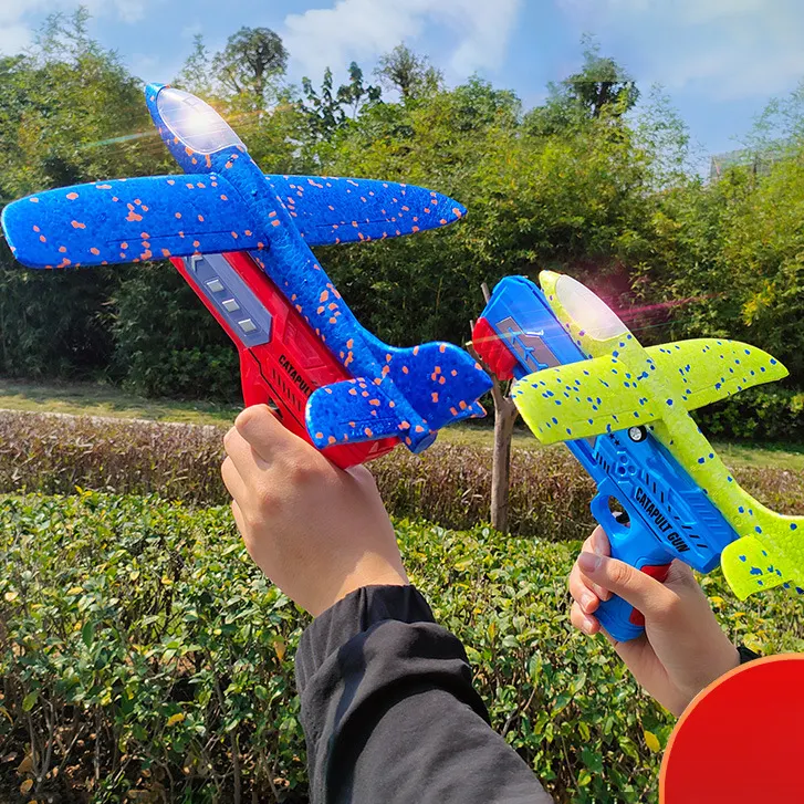 アウトドアプレイ子供フライングフォーム飛行機イジェクションフォーム飛行機キッズランチャーおもちゃの銃