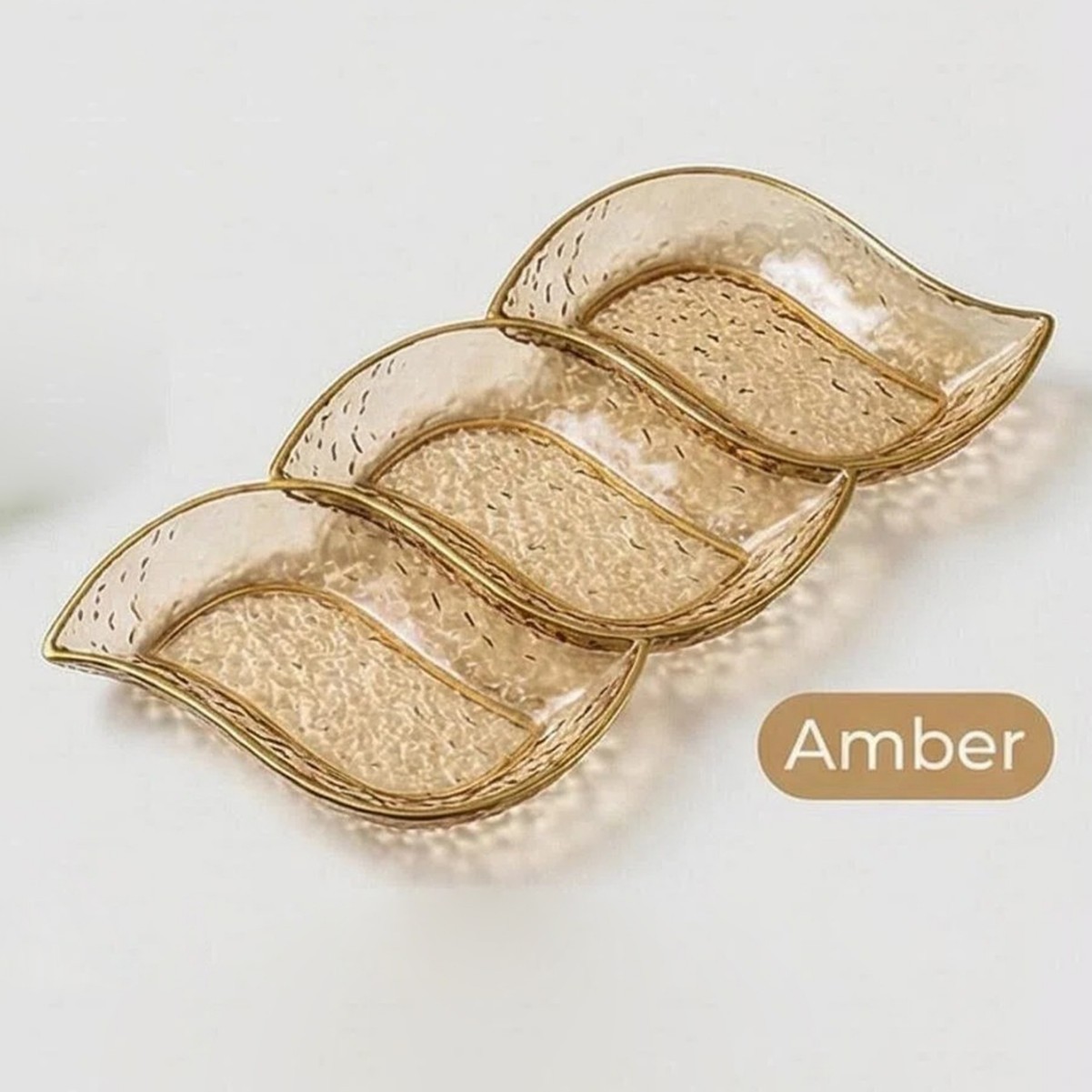Amber-colored three-panel palette with wavy gold trim