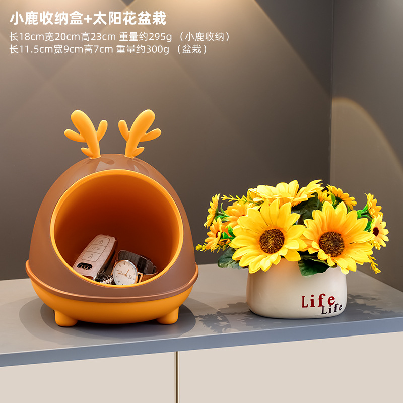 Deer storage box with sunflower potted plant