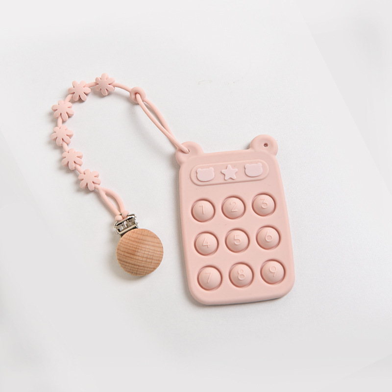 Juguete de clic rosa claro + cadena anticaída de flores con clip de madera