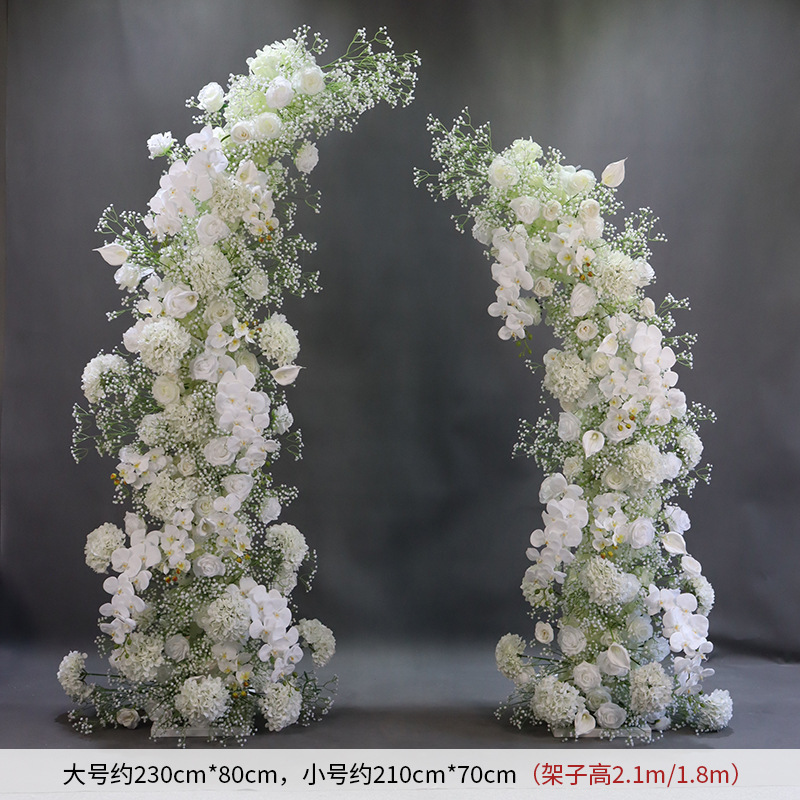 white babys breath ox horn door flower arrangement with stand