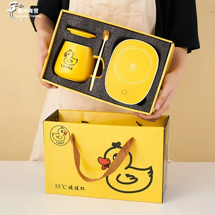 Regalos de Navidad viaje dibujos animados lindo pequeño pato amarillo en forma eléctrica calentada cerámica café taza térmica Usb para niñas