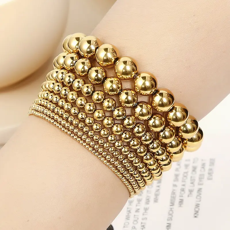 All'ingrosso nuovi modelli personalizzati elastici placcato oro 18K elastico in acciaio inossidabile bracciali con perline a sfera d'oro bracciali con perline per le donne