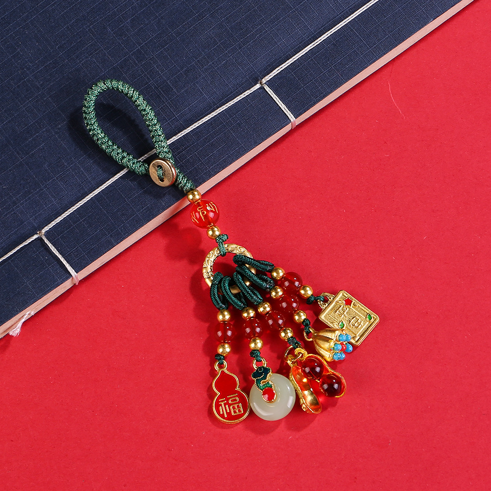 Pendentif émail vert noeud porte-bonheur