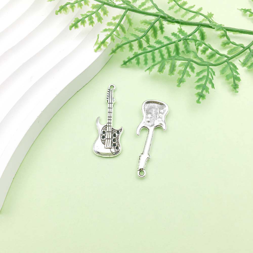 1 guitare argent antique - 2,8g - 12*38mm - 4841