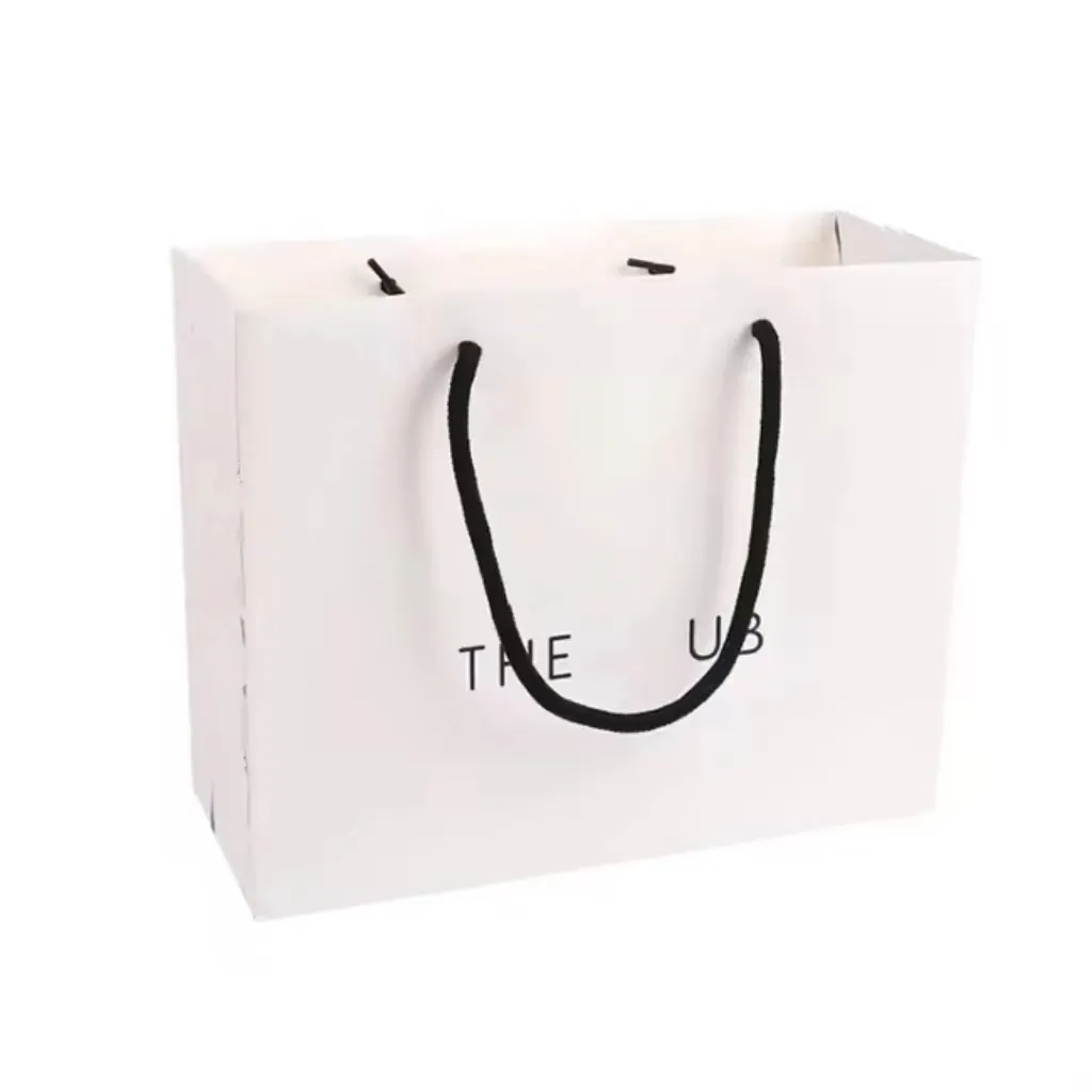 Tas belanja karton putih logo kustom mewah dengan tas kertas pita untuk pakaian gaun sepatu mantel tas kertas pita dengan pegangan