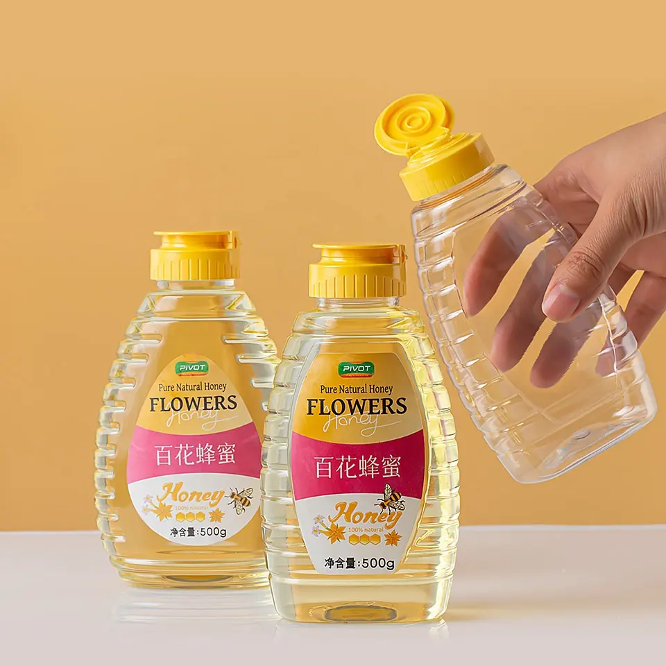 Botella de plástico exprimible de miel natural pura con edulcorante de jarabe de 500g OEM/ODM con tapa abatible de válvula de silicona