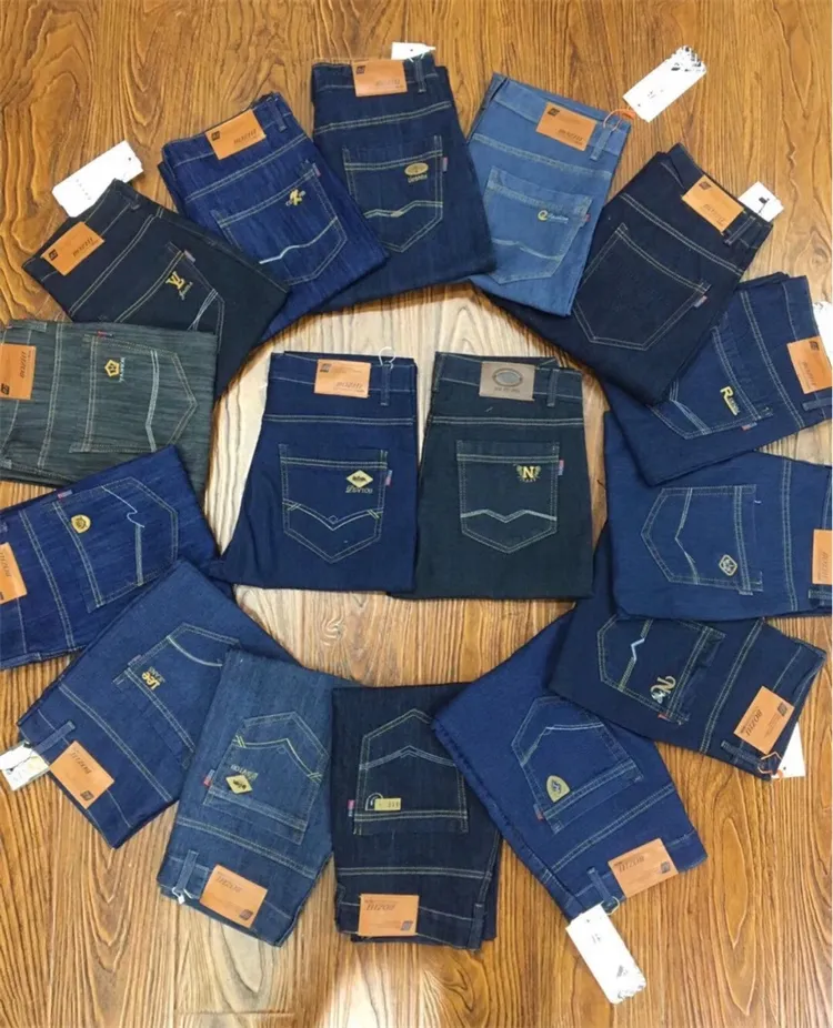 Jeans all'ingrosso delle donne degli uomini forniti prezzo poco costoso di vendita all'ingrosso di consegna casuale
