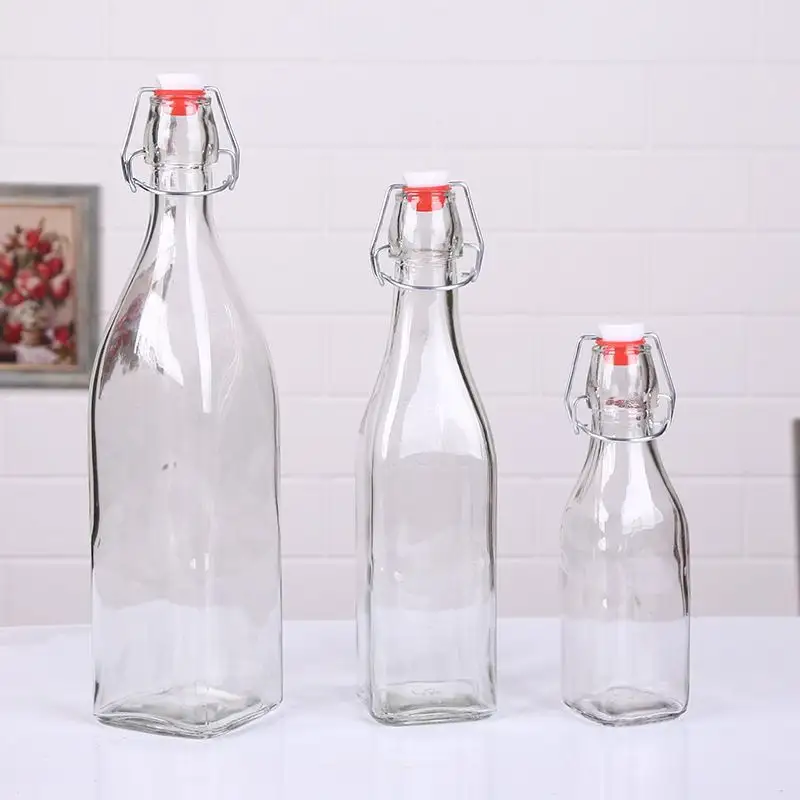 Botellas de vidrio de 12oz, 16oz, 34 oz, transparente/ámbar/Azul, tapa abatible, tapa de bloqueo de sellado para salsa de leche, licor/alcohol