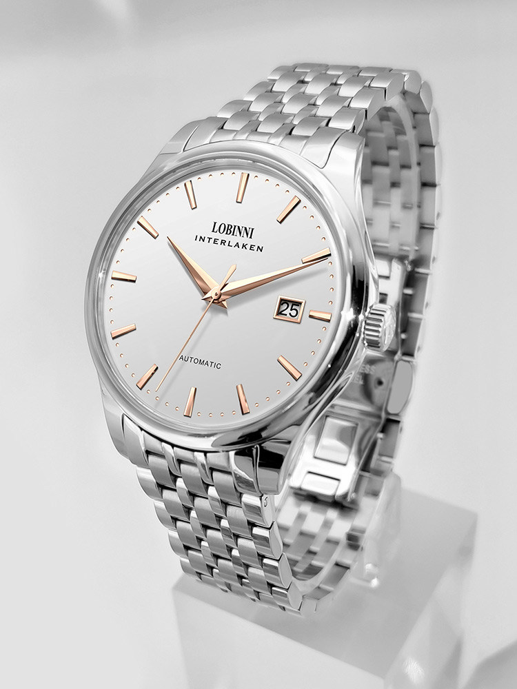 Boîtier argenté - cadran or rose - bracelet en acier