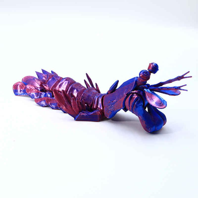 Camarón de piel roja y azul de 17 cm.