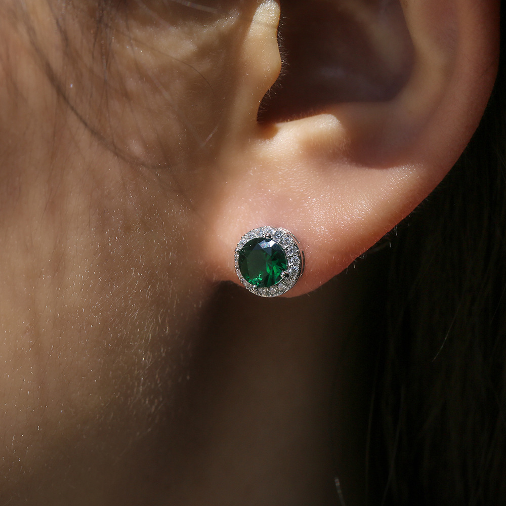 White gold plus green diamonds.