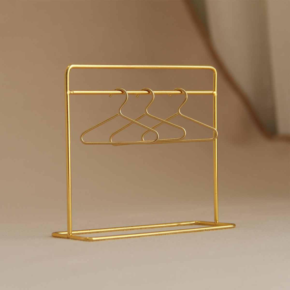 Gold standing coat rack