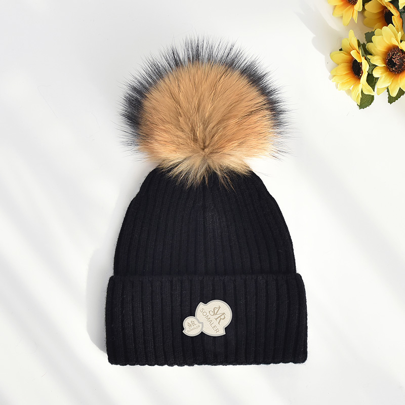 Black with brown pom