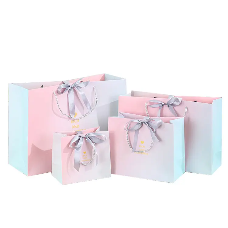 Bolsas de papel decorativas personalizadas de lujo Bolsas de papel de compras hechas a medida