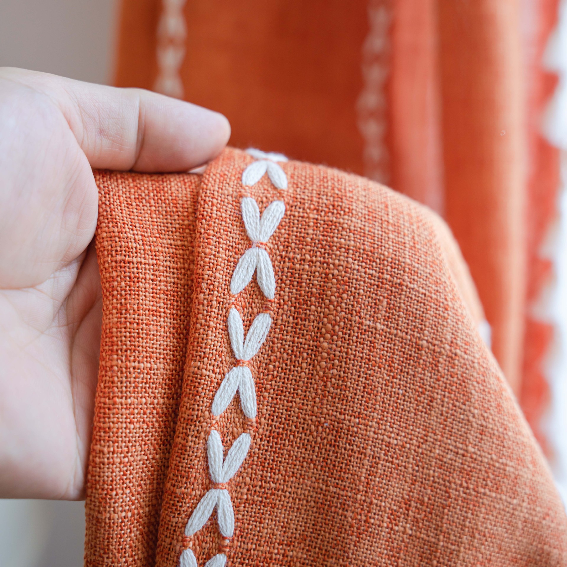orange multiple lines beige tassel