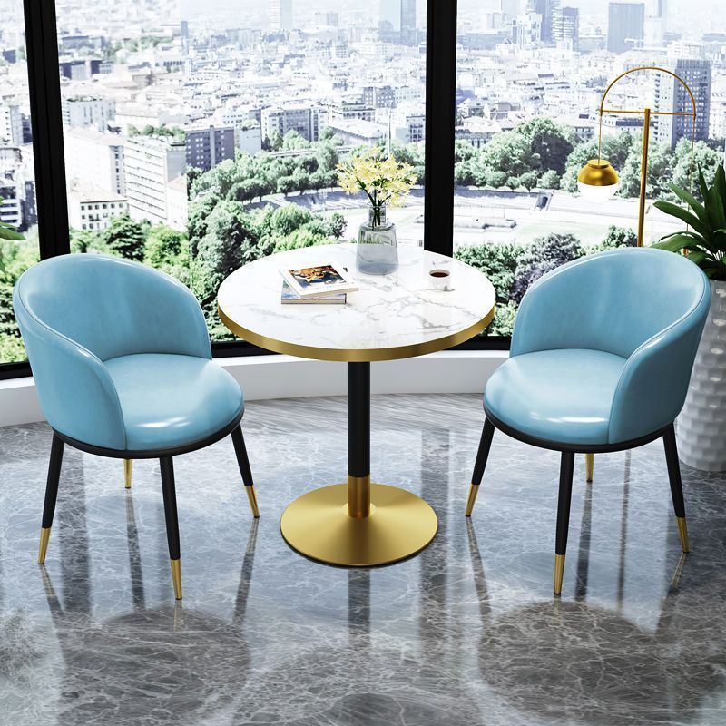 Light blue leather chair imitation stone round table