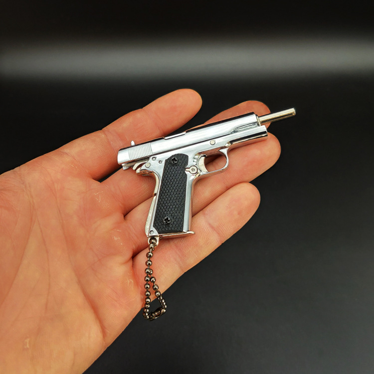 ของขวัญพวงกุญแจโมเดลปืนทำจากโลหะทั้งหมด1911สีเงินสว่าง1:3อยู่รอด - Product Image 5