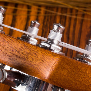 Juego de cuerdas de fábrica de ukeleles y guitarras pequeñas, cuatro cuerdas de nailon para instrumentos de cuerda, empaquetadas en el Reino Unido