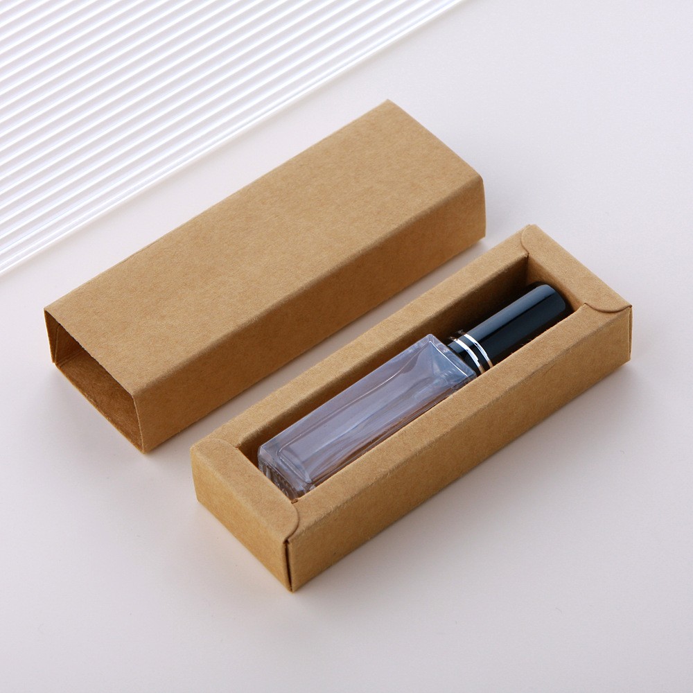 Botella pulverizadora de vidrio transparente + tapa negra de doble línea + caja marrón