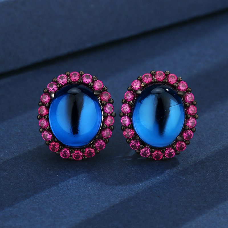 Clous d'oreilles en cristal pointu bleu or noir