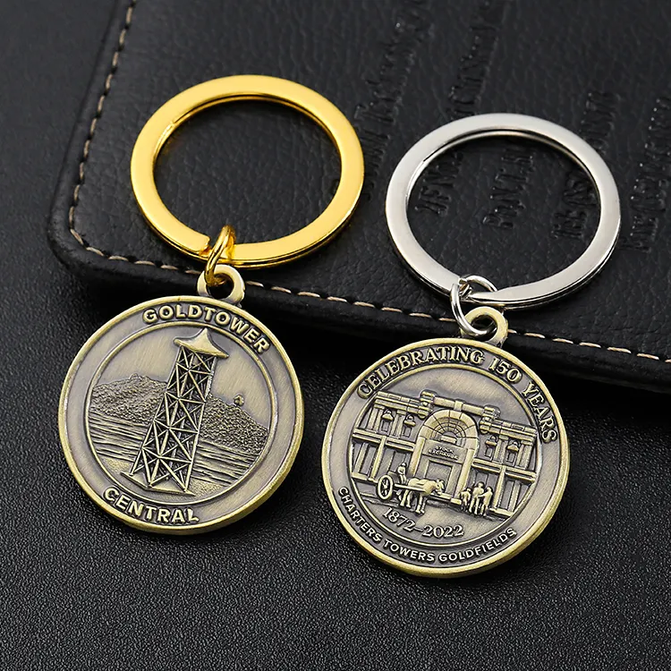사용자 정의 양각 로고 골드 타워 중앙 150 년 청동 기념 금속 동전 모양 키 체인
