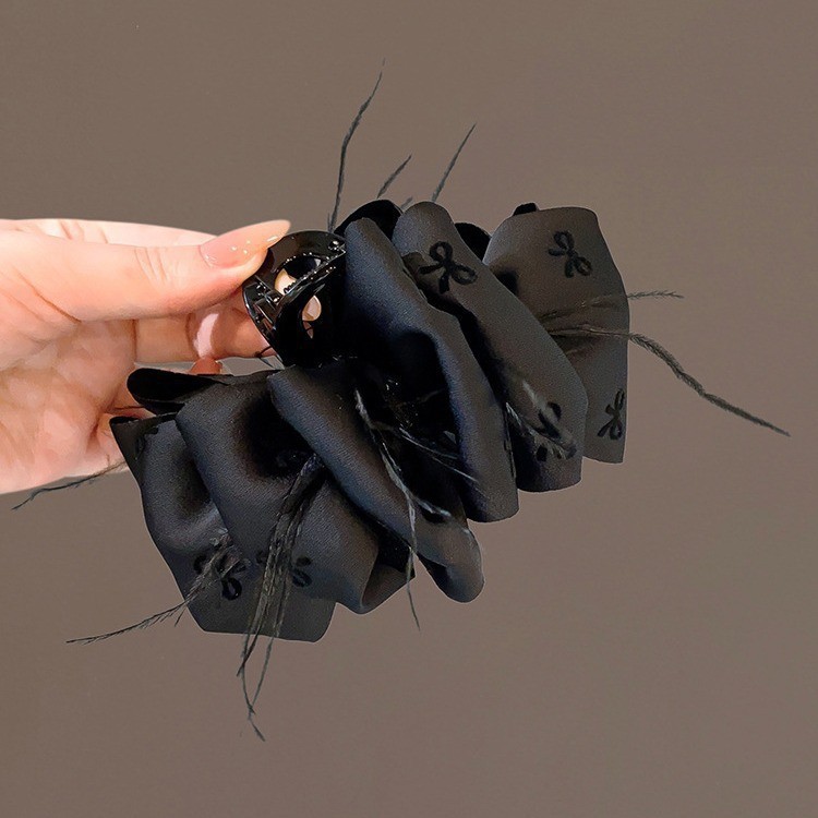 9 black feather printed bubble hair clip
