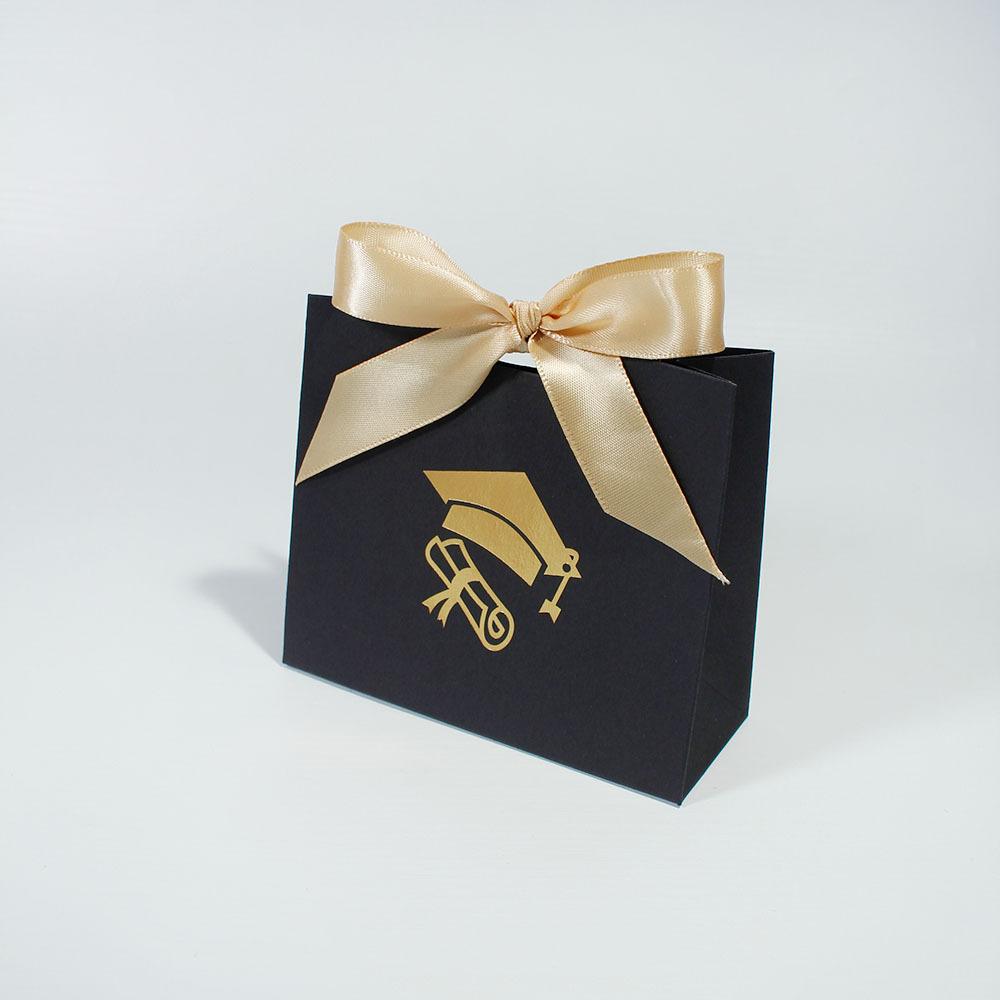 Black bag with gold ribbon