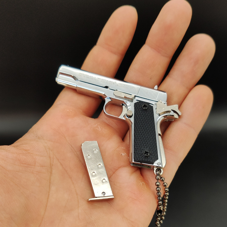 ของขวัญพวงกุญแจโมเดลปืนทำจากโลหะทั้งหมด1911สีเงินสว่าง1:3อยู่รอด - Product Image 6