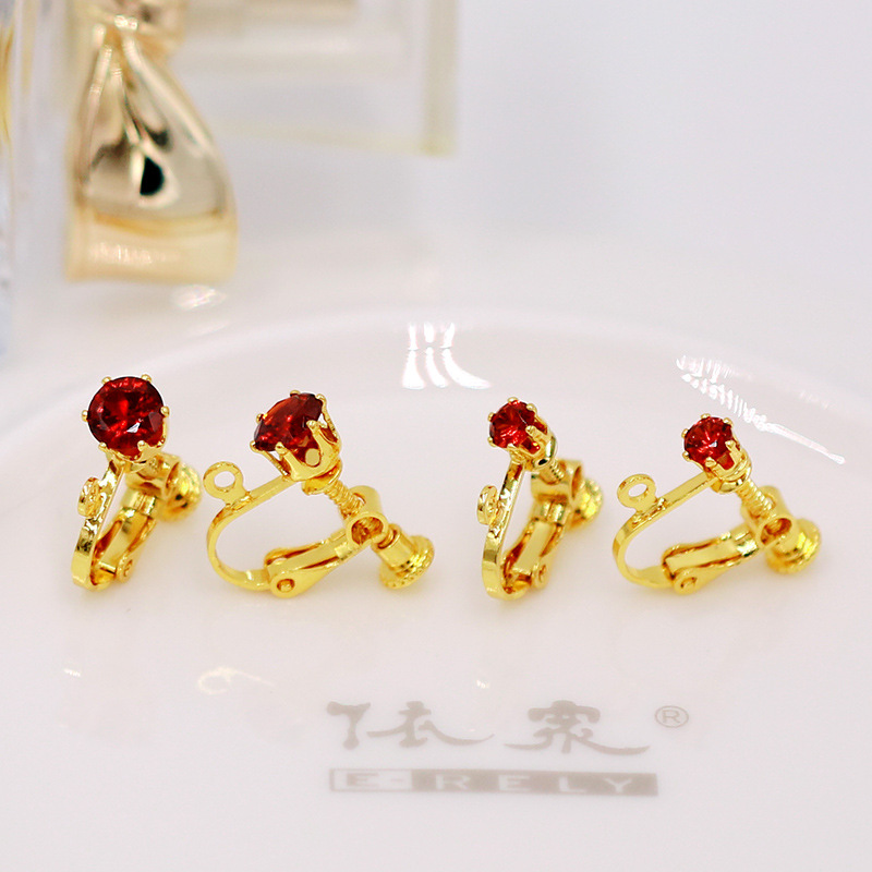 Clips d'oreilles en or pur 18 carats avec zirconium rouge grenat