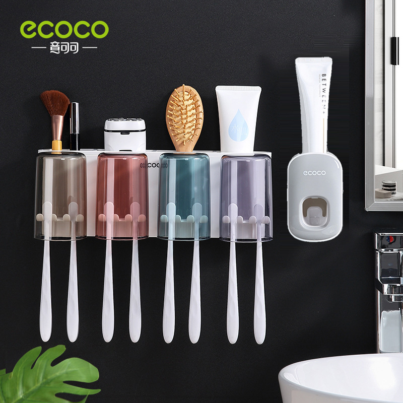 Four-cup toothpaste dispenser, gray and white