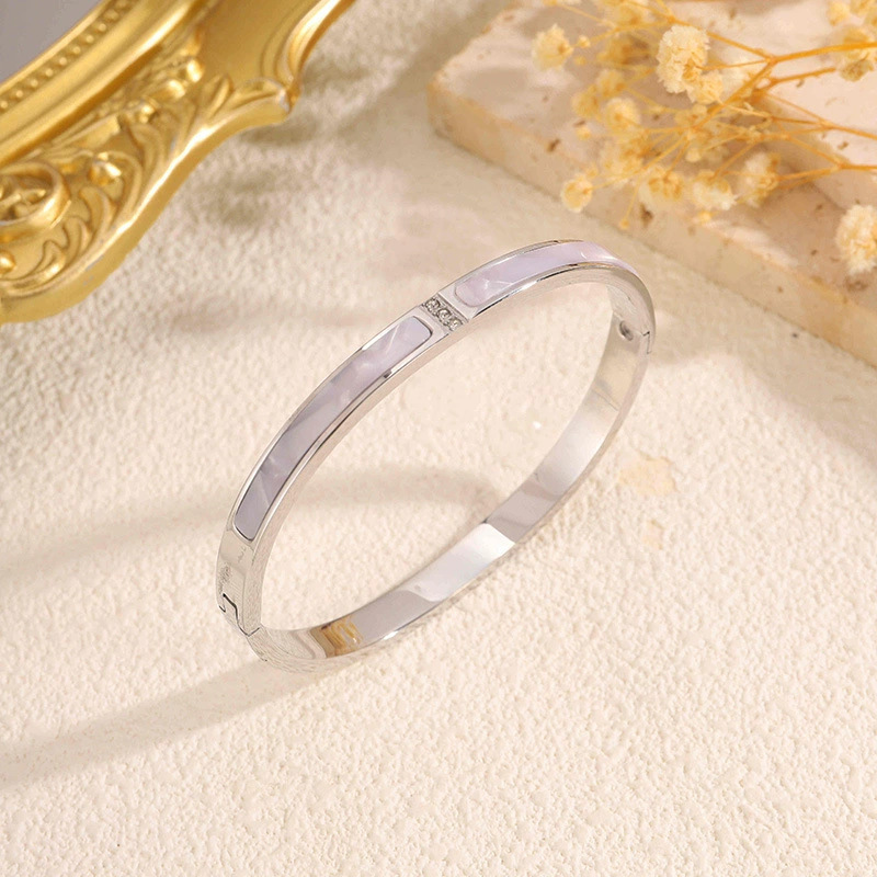 2 bracelets diamants ornés de coquillages en argent