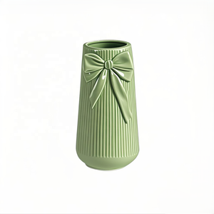 Green Ceramic Vase with a <strong>Bow</strong> Is Ideal for <strong>Creating</strong> Charming with Its Simple and Elegant Design Perfect for Any Occasion - Product Image 1