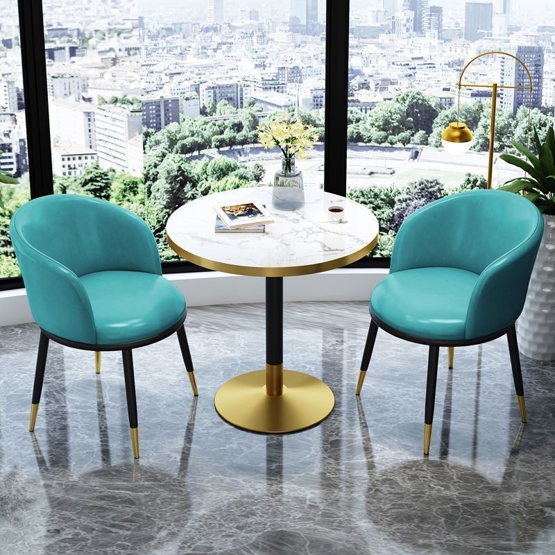 Cyan leather chair imitation stone round table