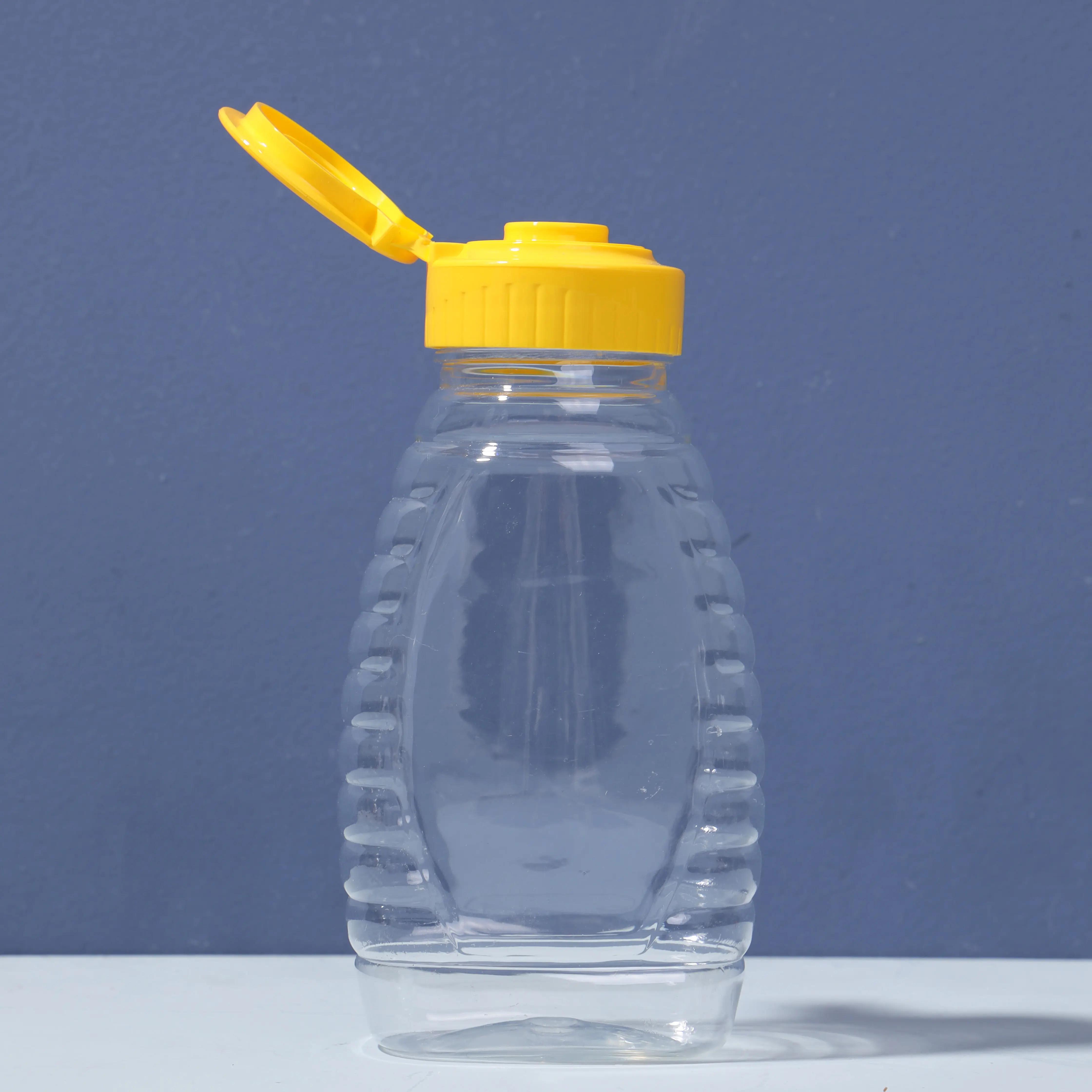 Honig Plastik flasche Lieferanten 100g 150g 250g 500g 1000g PET Plastik Quetsch flasche für Wasser Honigs auce mit PP-Kappe