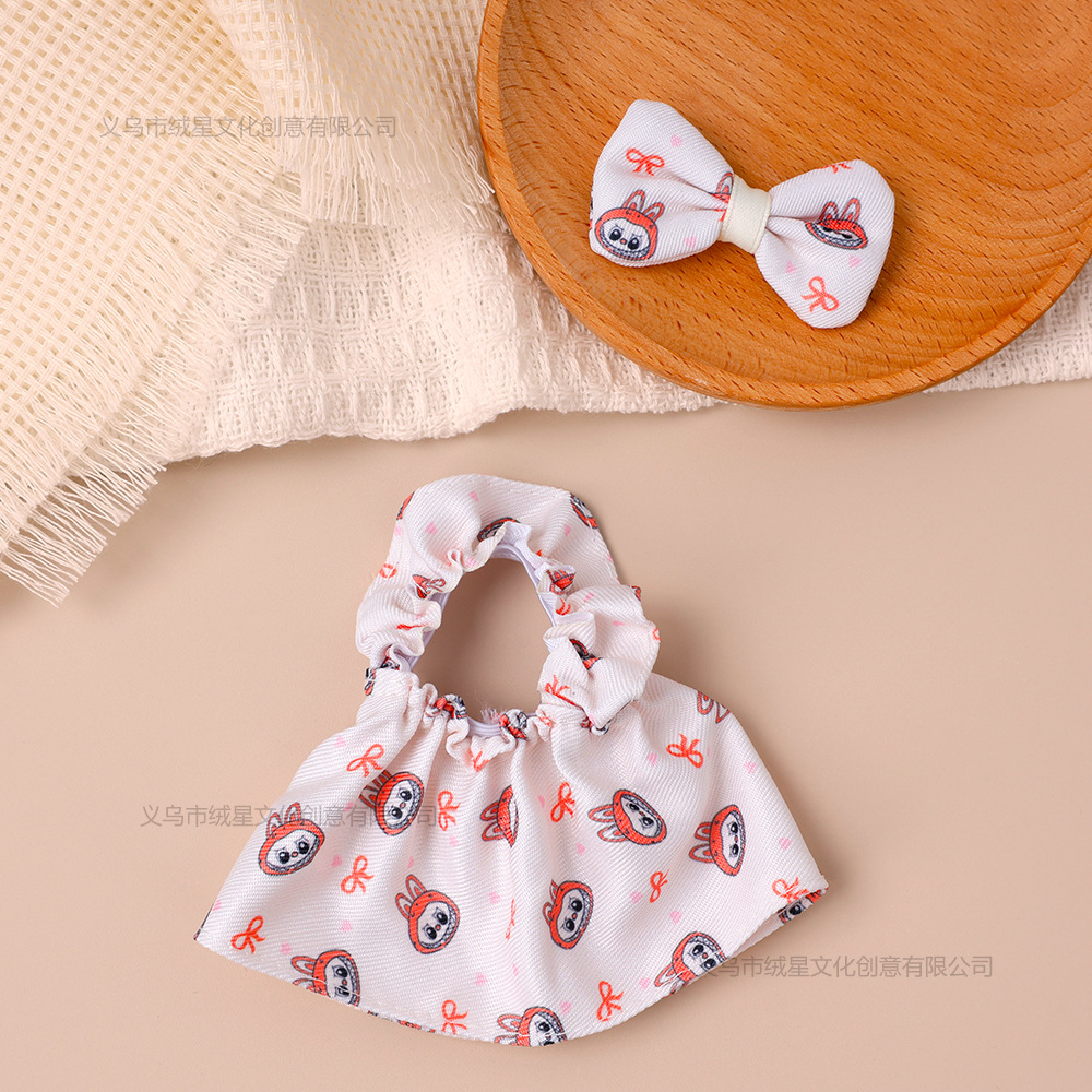 Robe imprimée blanc cassé façon riz avec nœud, pour poupée de 14 à 17 cm.