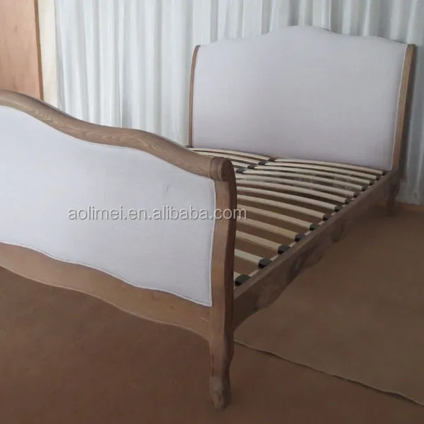 Cama antigua tapizada de lino francés