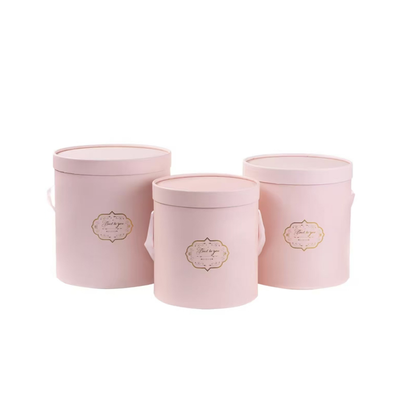 Three pink covered cases (one large, one medium and one small)