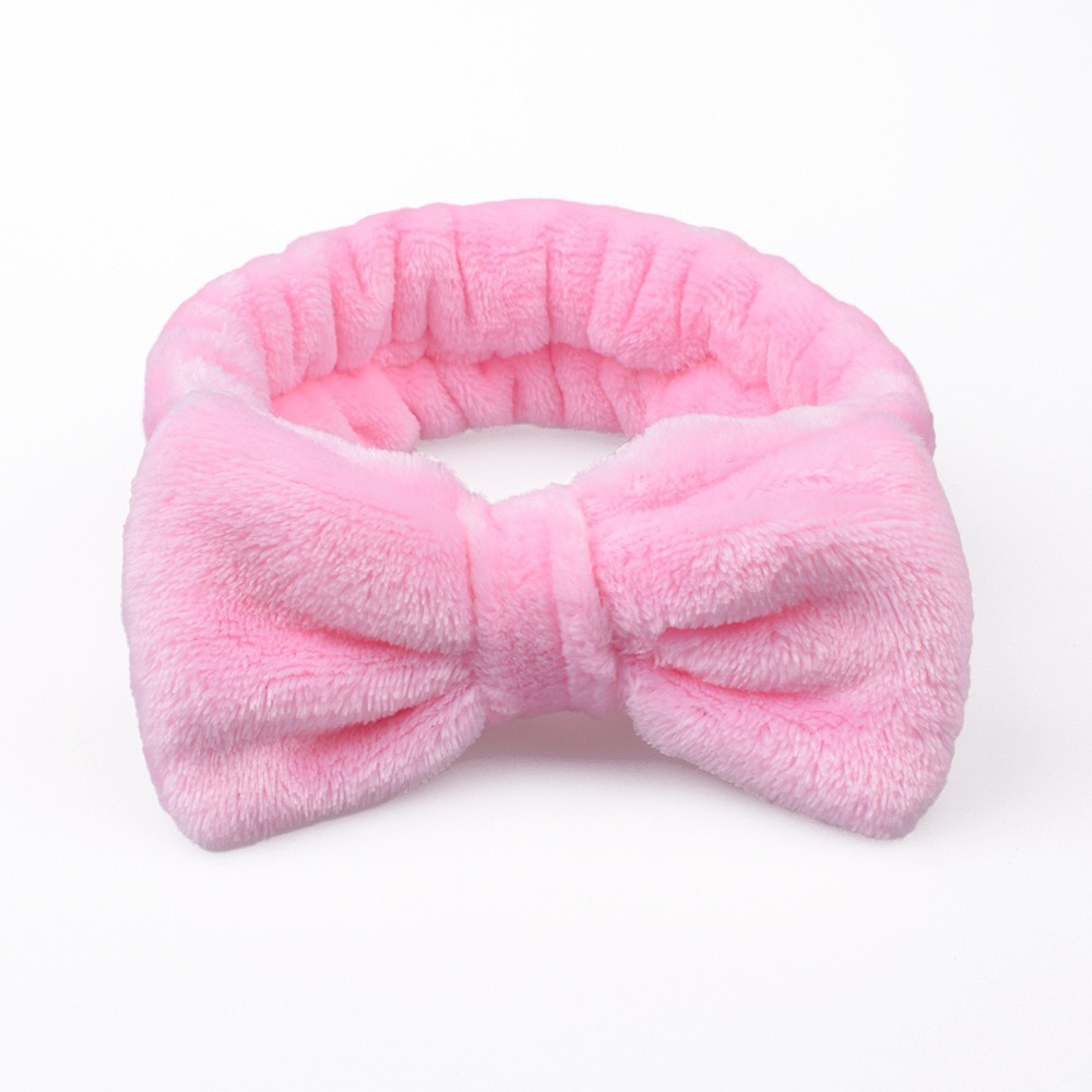 Diadema rosa puro con lazo.