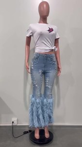 休闲时尚弹力中腰牛仔长裤女珍珠羽毛撕开牛仔裤
