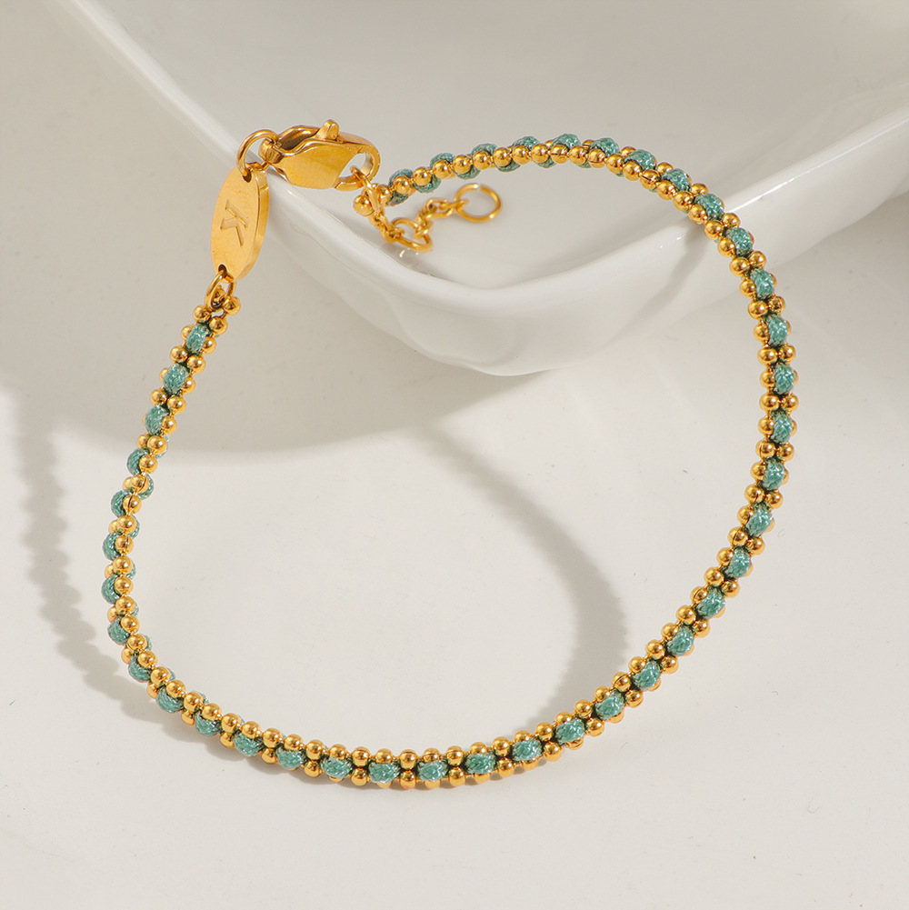 petit bracelet en corde verte tressée dorée