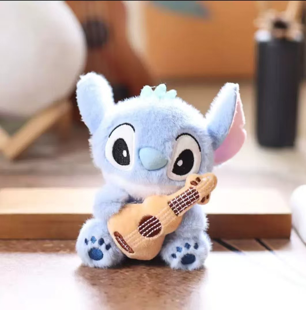 Stitch sitting holding guitar