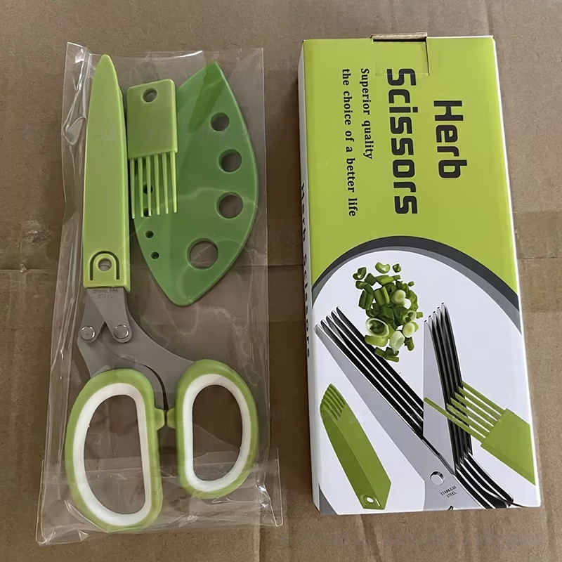 Ensemble de quatre ciseaux verts et blancs