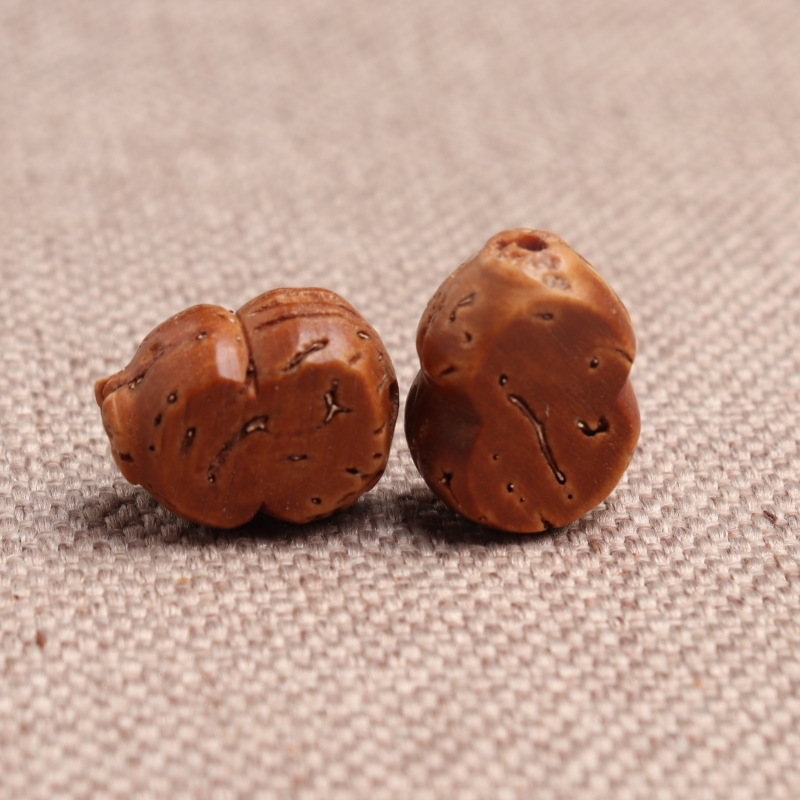 Hueso de melocotón de calabaza plana