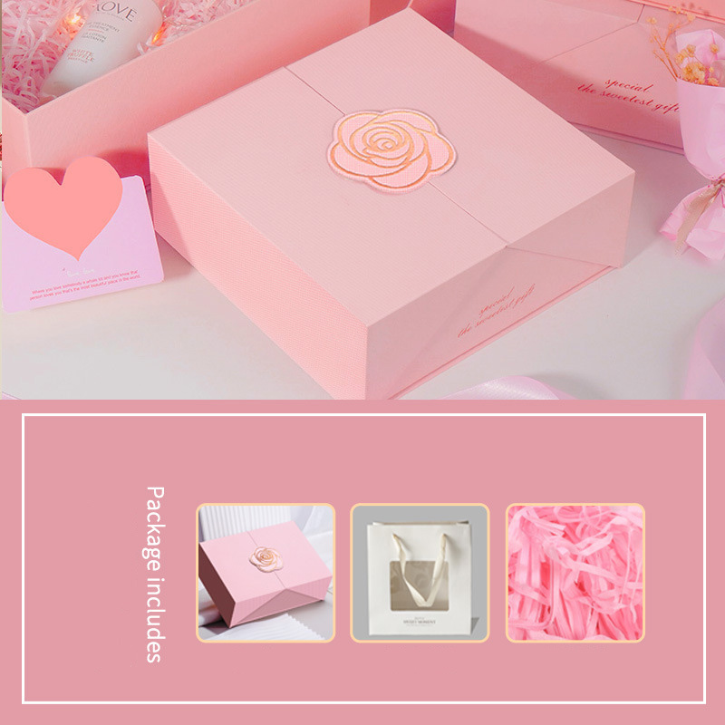 Pink gift box with white gift bag and raffia