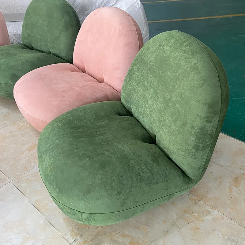Fauteuil simple inclinable en tissu velours, design moderne, orange vert et rose, idéal pour un salon